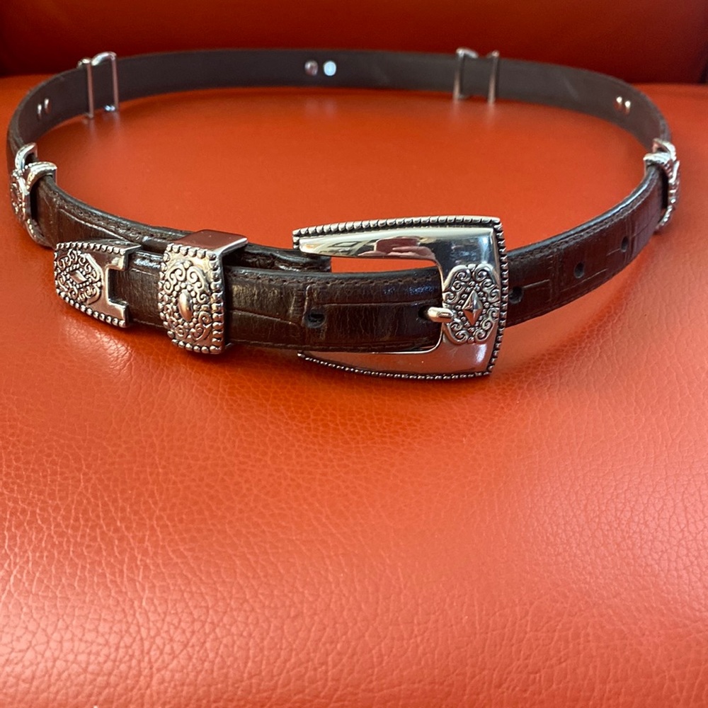 Beautiful supple brown leather belt with silver tone southwest style accents.